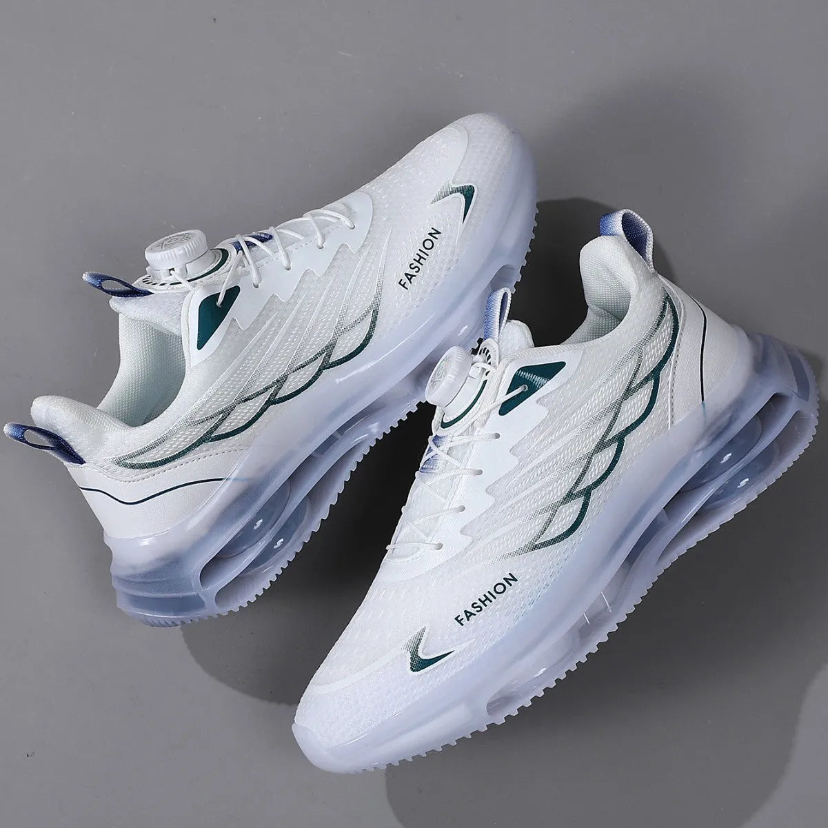 Men's white low-top casual sneakers with mesh upper, rotating button, and rubber sole.