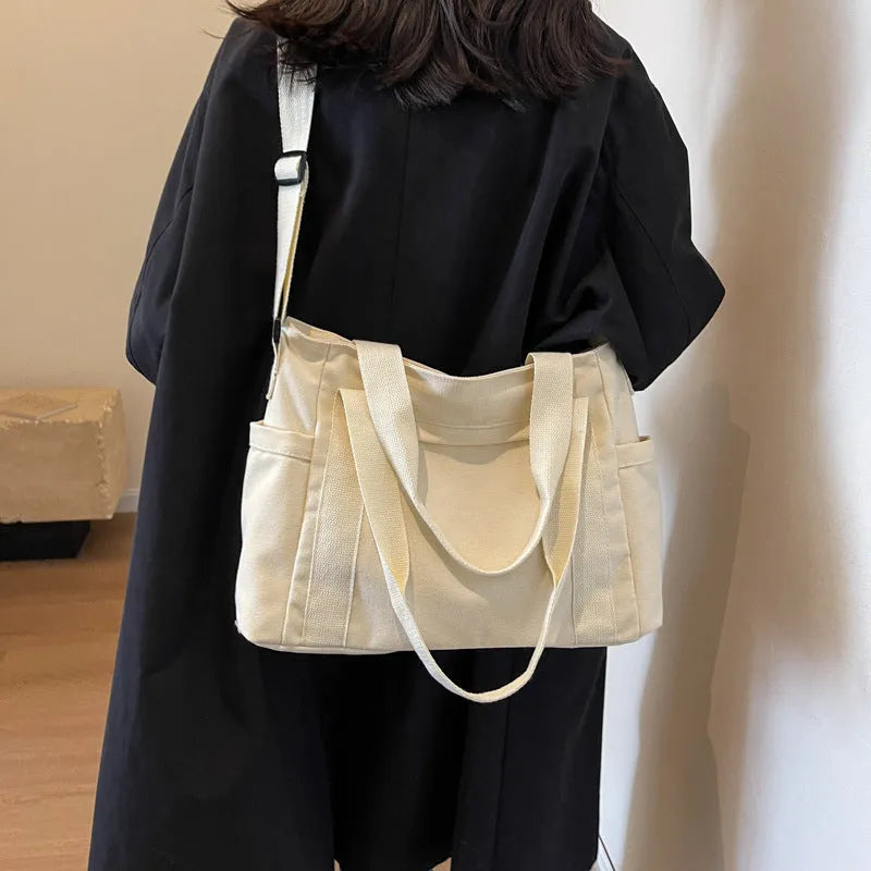 Women's polyester canvas shoulder bag with sandwich pocket in black, white, brown, or green