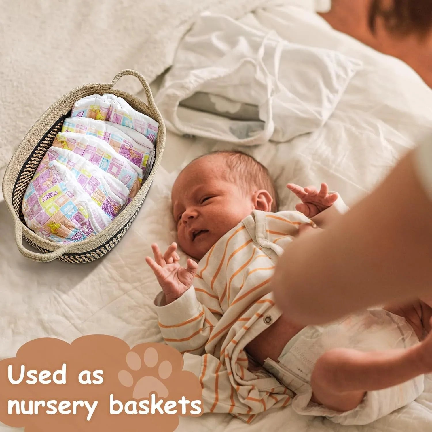 Light beige handmade cotton rope storage basket with a handle on a wooden floor.