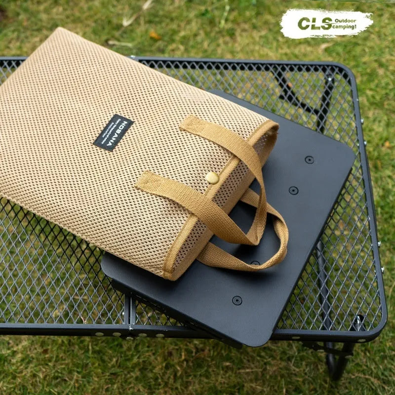 CLS aluminium alloy dual-use folding camping table shown converted into a stool with a green PU mat cushion.