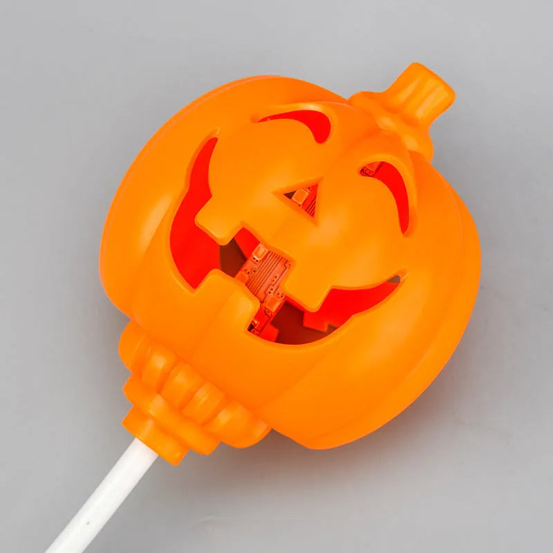 Plastic pumpkin-shaped USB lamp emitting yellow or purple light, 8.3cm wide by 22cm tall