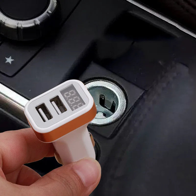 Mini digital display car charger with USB port in gold colour showing voltage readout