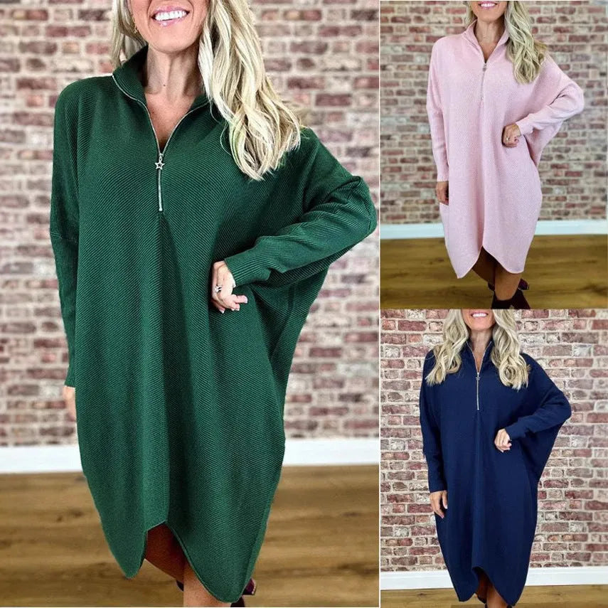 Women's solid colour loose knitted dress with raglan sleeves and a zipper detail.