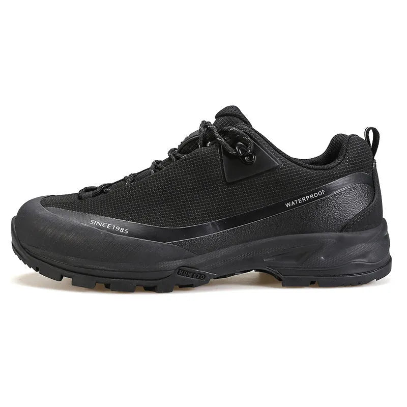 Men's low-top mountain climbing shoes with leather mesh upper and non-slip rubber outsole in black colour