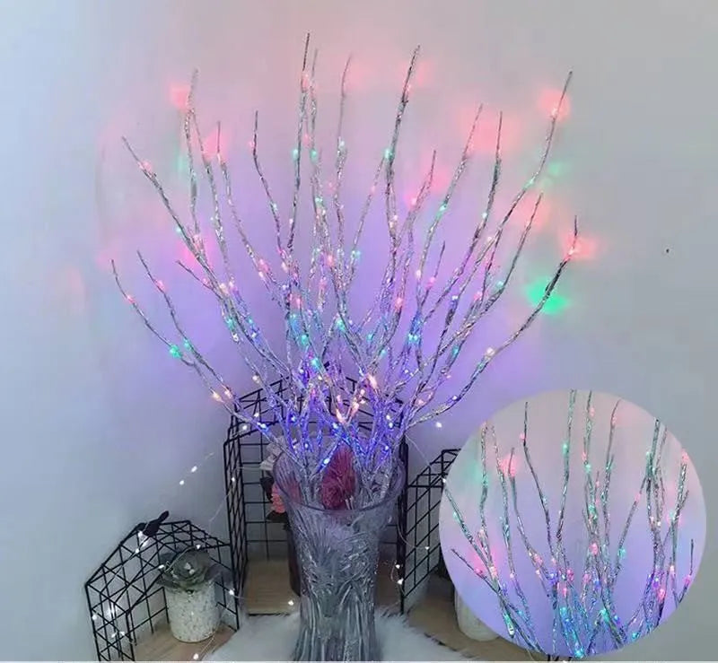 LED decorative tree light in a vase with silver branches illuminated in a choice of six colours.
