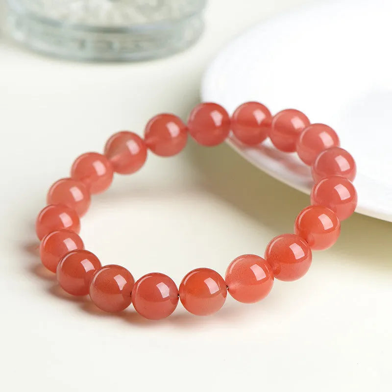 Natural South Red Cherry Red Agate bead bracelet shown in single and three-strand styles.
