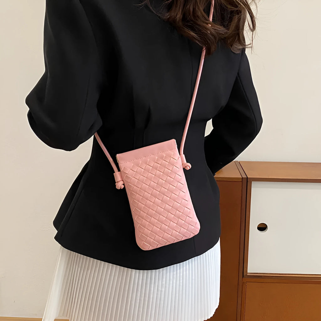 Vintage weave crossbody bag in retro style showing square vertical shape and woven texture