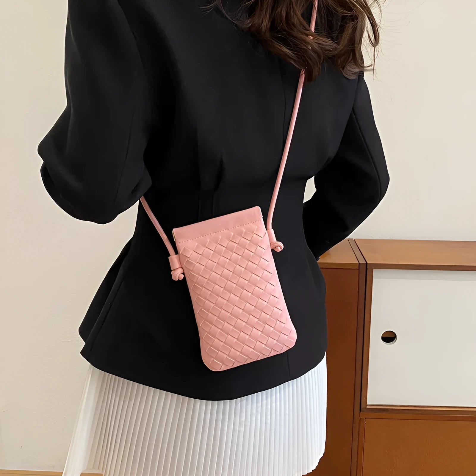 Vintage weave crossbody bag in retro style showing square vertical shape and woven texture