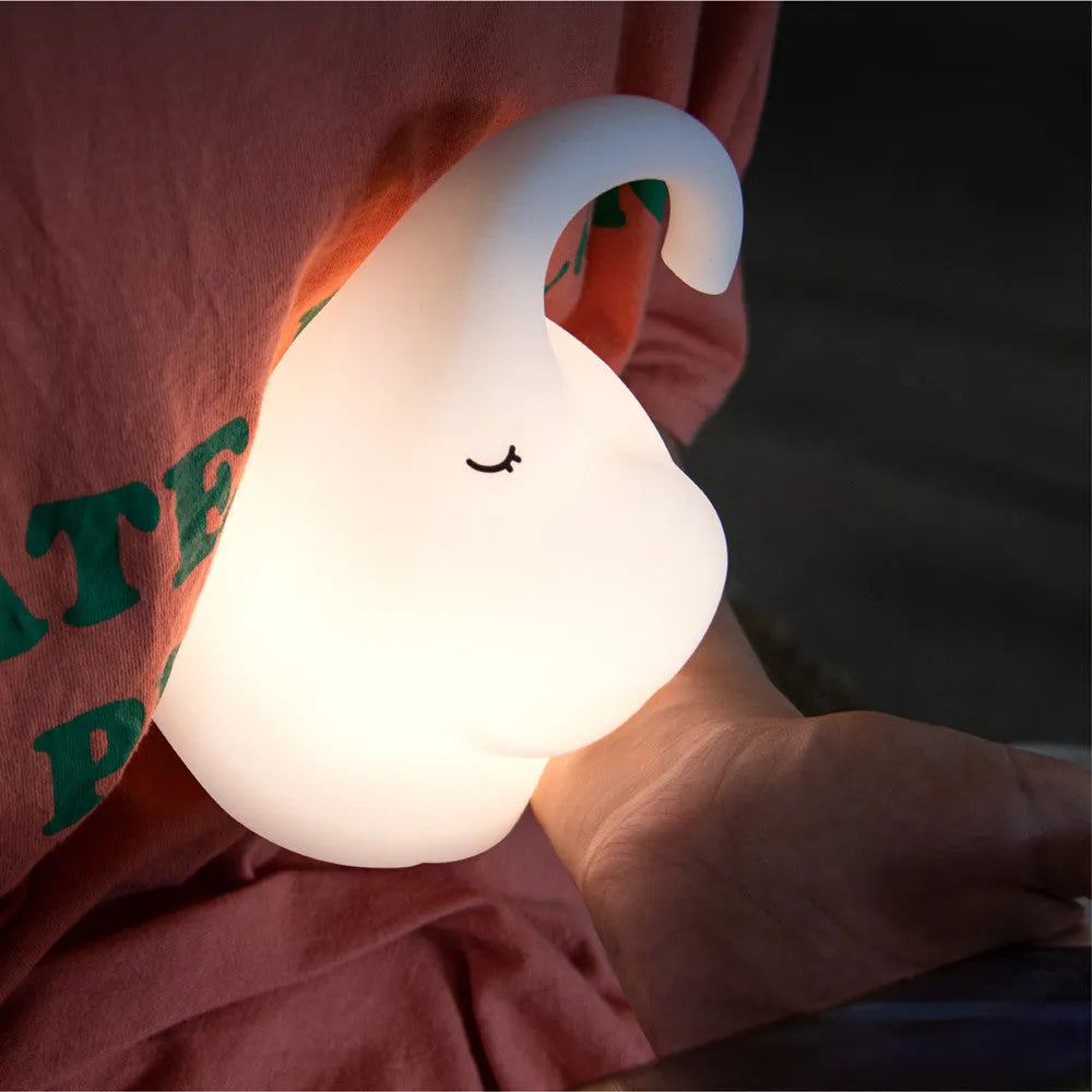 DOMI Elephant silicone night light with warm white glow on bedside table