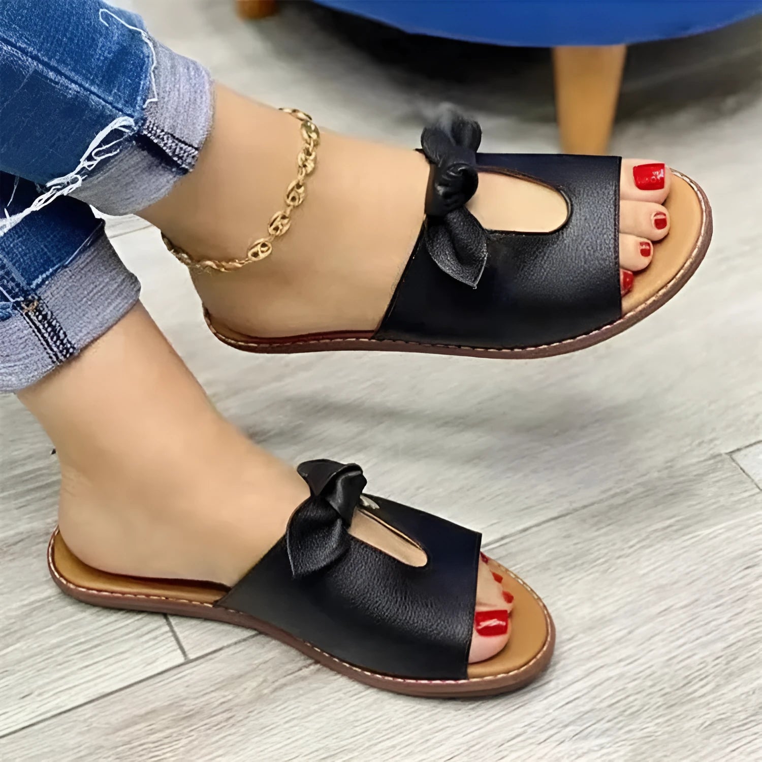 Ladies fish mouth style sandals with a decorative bow on the artificial PU upper, shown in black.
