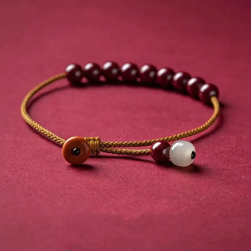 Cinnabar and Hetian jade bracelet with geometric beads on adjustable hand-woven cord