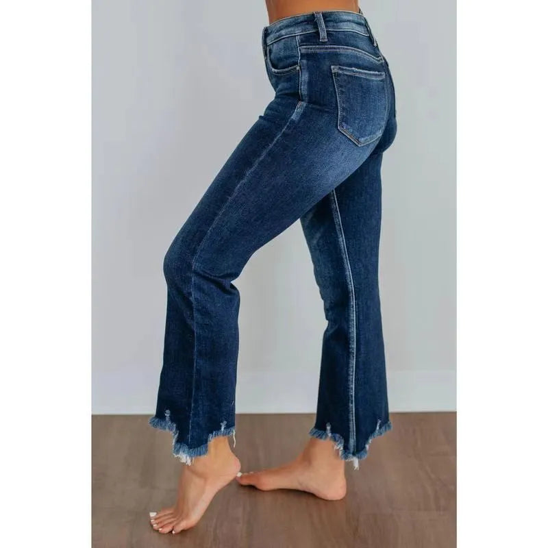 Women's solid colour denim jeans in dark blue or light blue, made from cotton fabric.