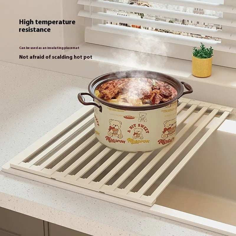 Foldable milky white stainless steel kitchen draining rack showing tri-fold design