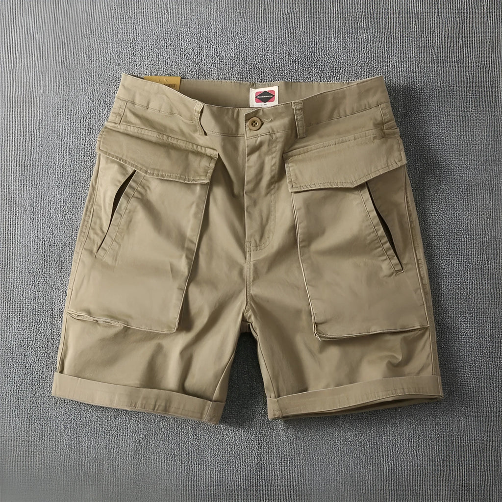 Men's cotton cargo shorts with stretch fabric in khaki colour, showing multiple pockets and straight-leg cut.