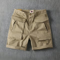 Men's cotton cargo shorts with stretch fabric in khaki colour, showing multiple pockets and straight-leg cut.