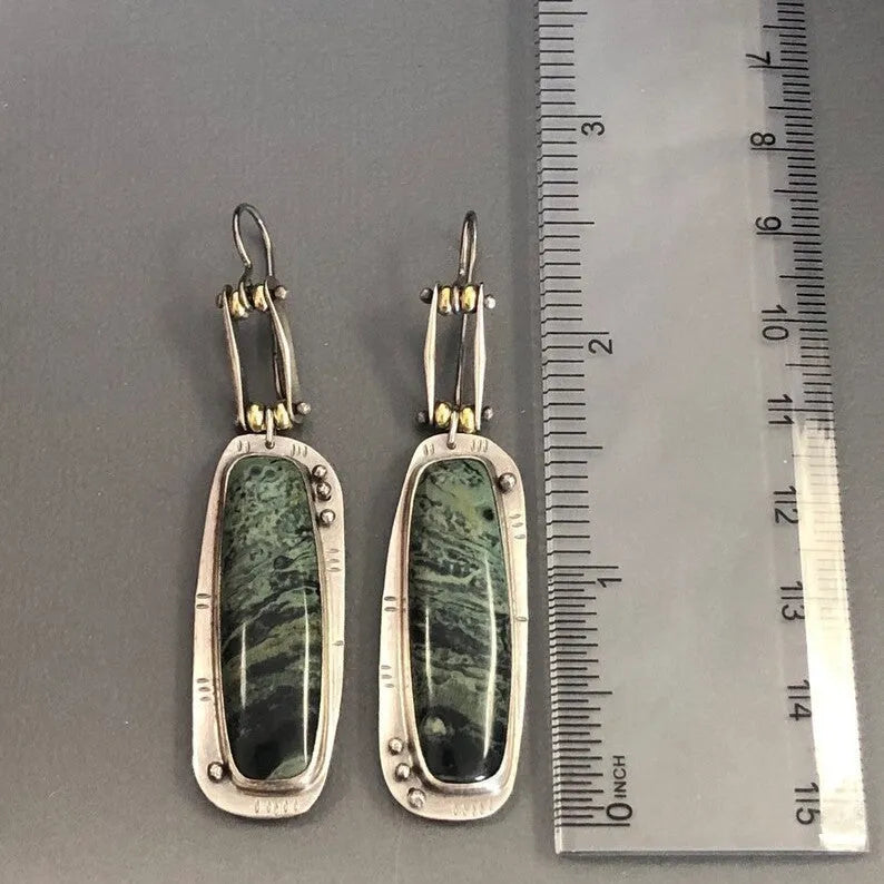 Geometric two-colour marble pattern alloy earrings with minimalist stud design