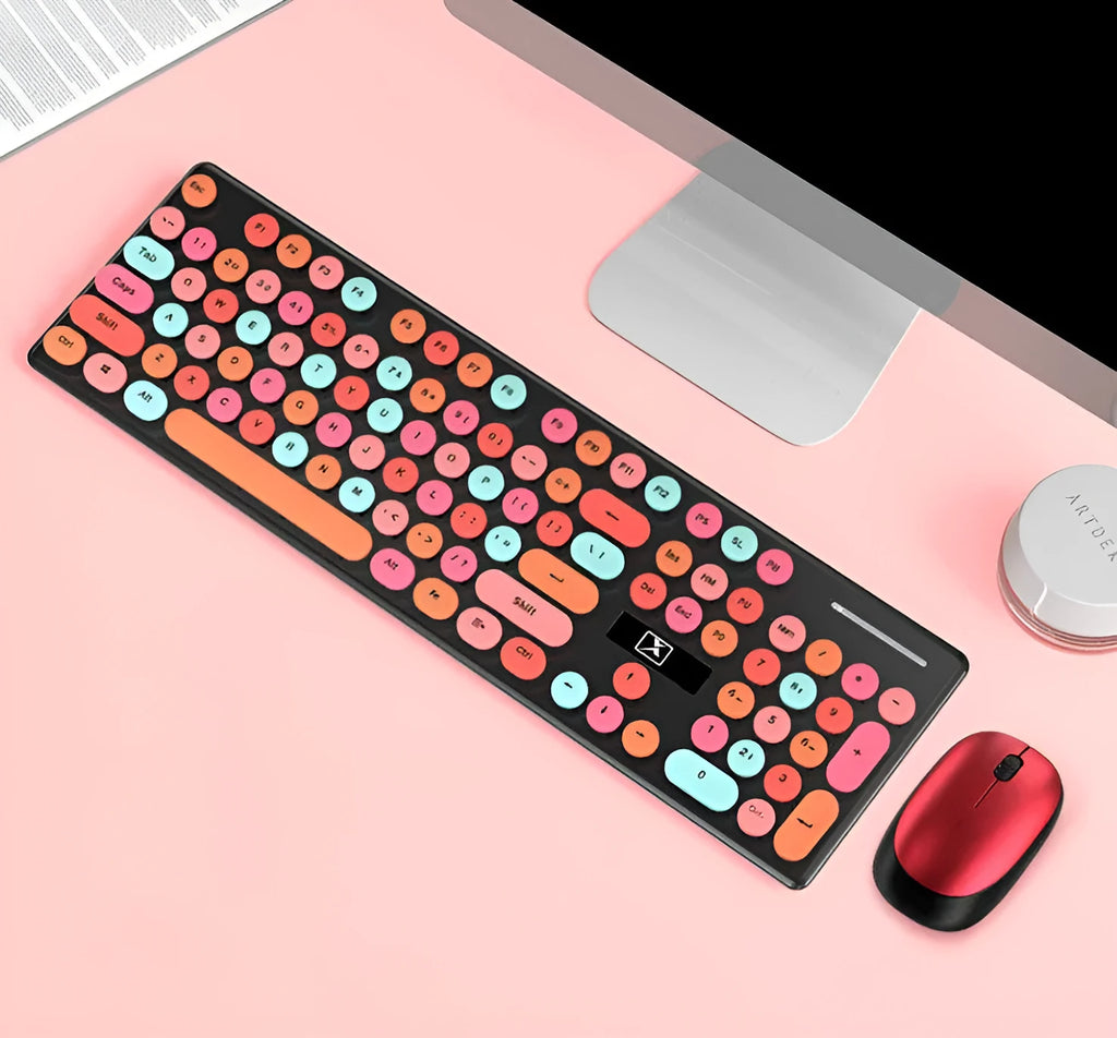 Vibrant yellow wireless punk manipulator design keyboard and mouse set on a desk.