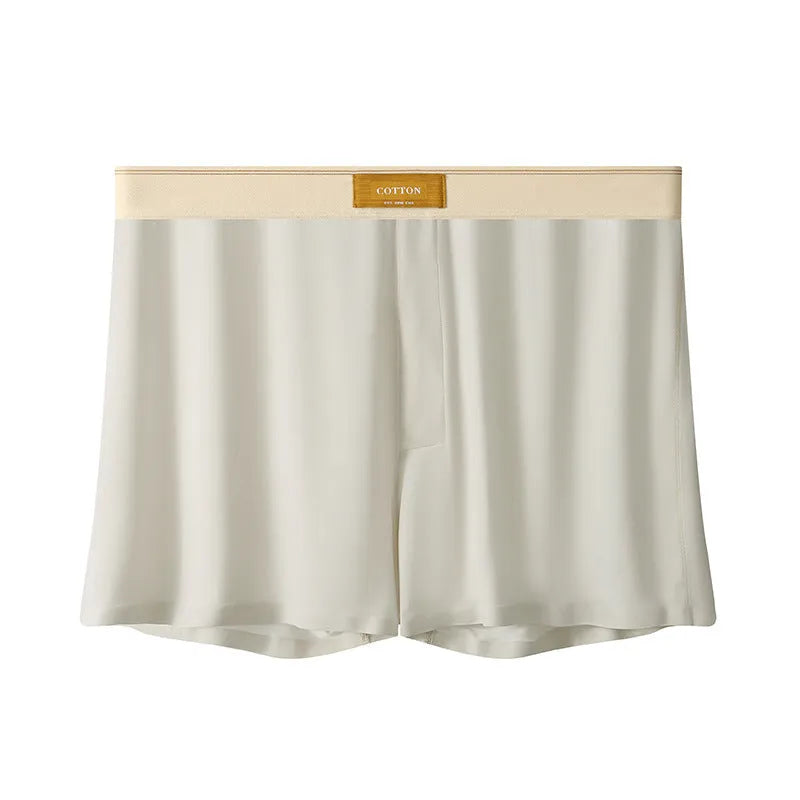 Men's solid colour loose ice silk underwear in a pack of three, shown in beige, black, and grey.