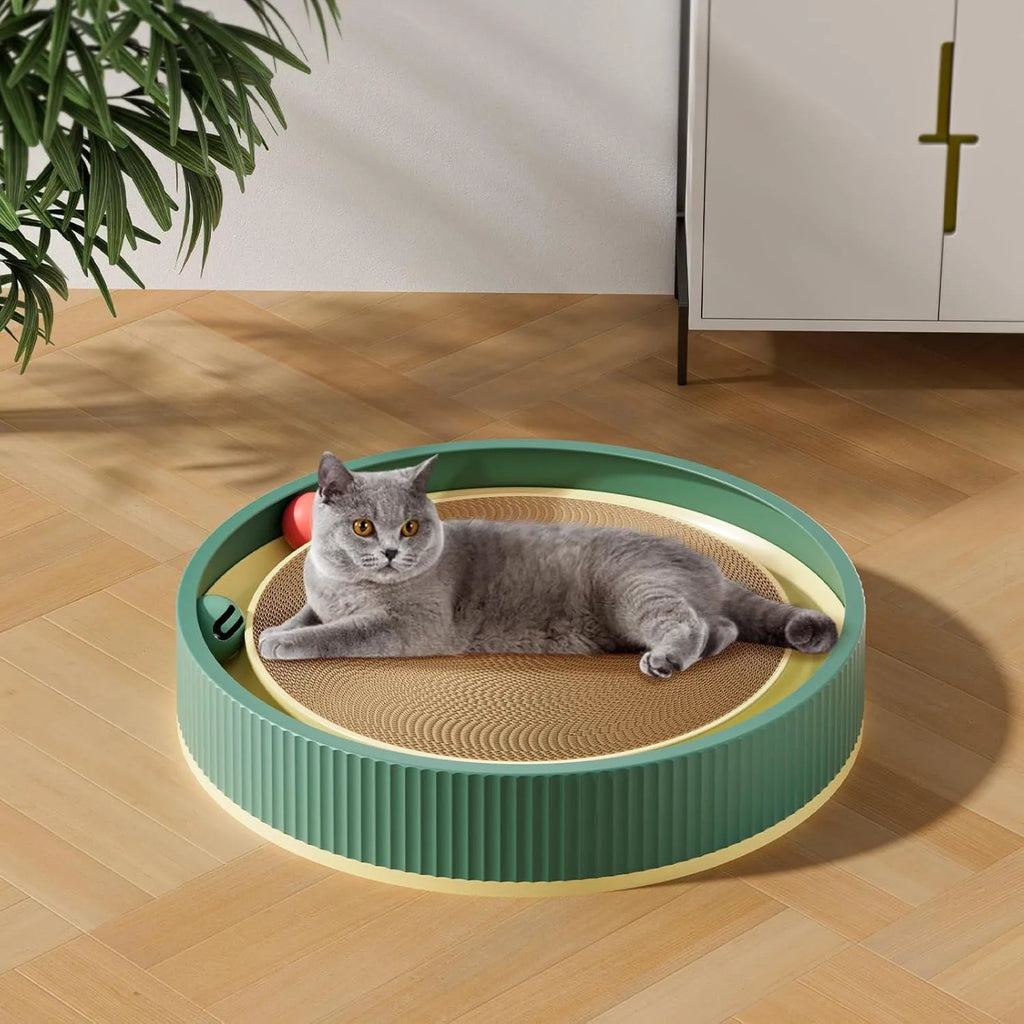 Large circular green cat scratching board with ball toys and replaceable cardboard core