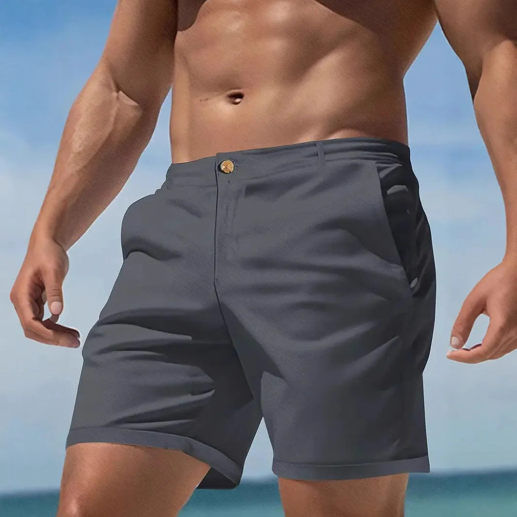 Men's straight-cut casual sports shorts in a solid colour, showcasing the micro-elastic cotton blend fabric.