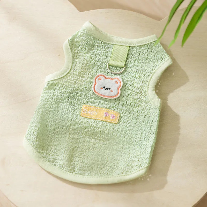 Hollowed-out cat clothes with bear patch in blue, green, yellow colours showing knitted fabric texture