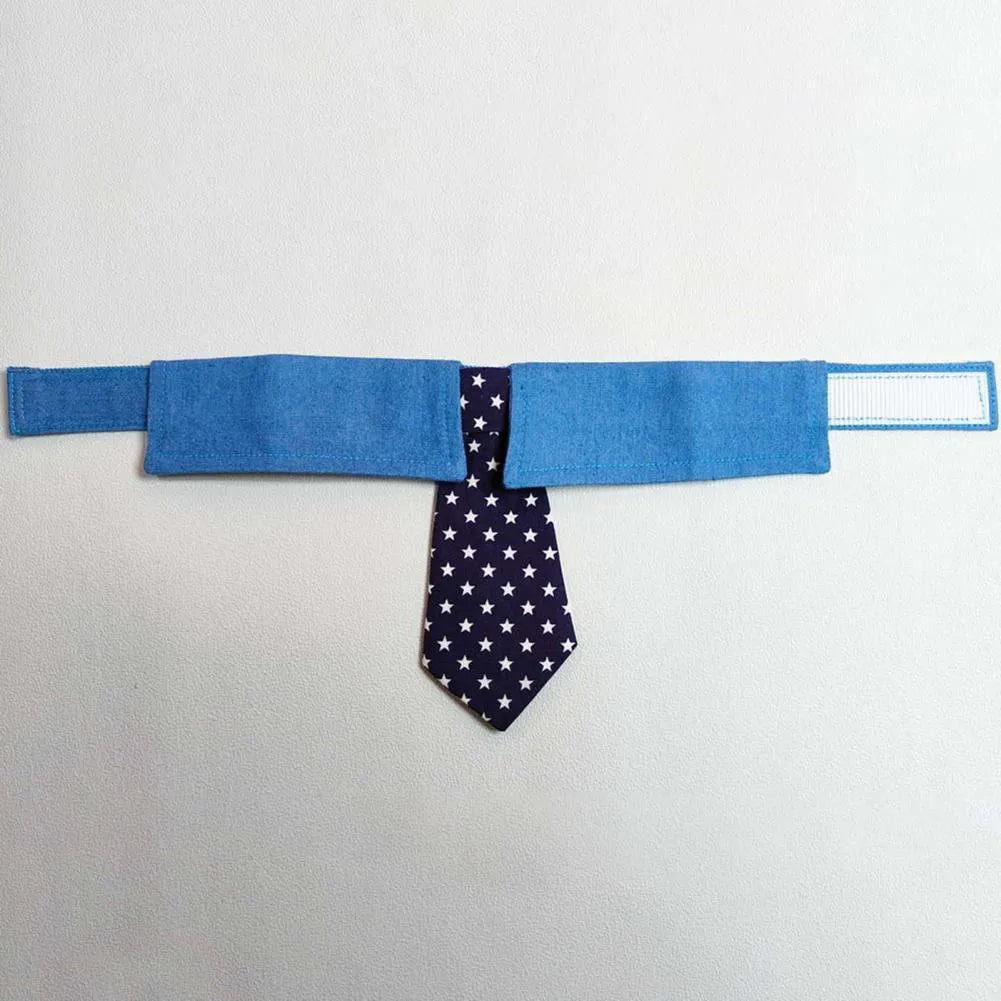 Blue denim dog collar with a star-patterned black bow tie, shown on a mannequin.