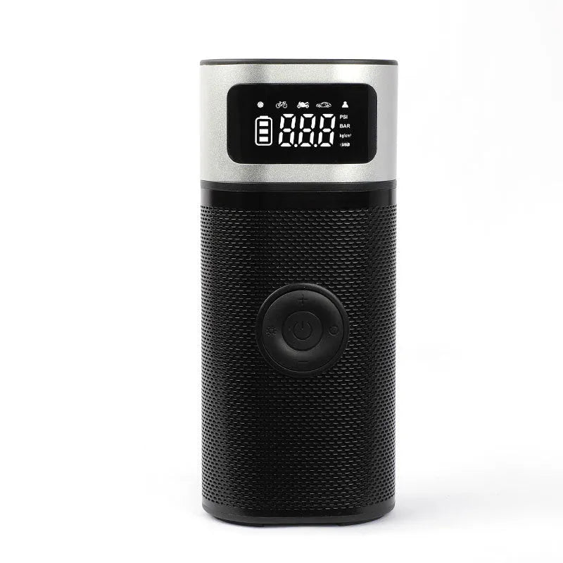 Black portable wireless car air pump with a digital display, inflation hose, and a set of nozzles on a black background.