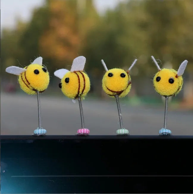 Yellow and black cartoon bee car decoration made from fur ball material measuring 3x3cm