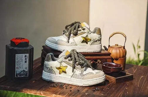 Green casual shoes with star pattern, mesh lining, and rubber sole on white background