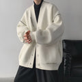 Women's loose fit knitted cardigan top coat in black or white colour