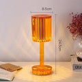 Amber K9 crystal table lamp with double-layered lampshade on a modern bedside table, warm LED light on medium brightness