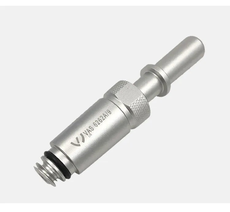 Silver metal transmission refuelling joint for VAS6262-9 tool on a workshop bench.