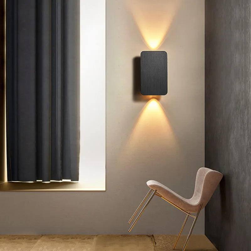 Slim minimalist Nordic-style LED wall lamp mounted on a wall, shown in a choice of colours and sizes.