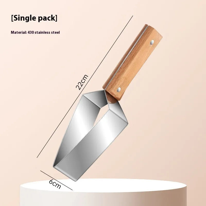 Stainless steel watermelon splitter with triangle cutting piece and protective cover on a kitchen counter.