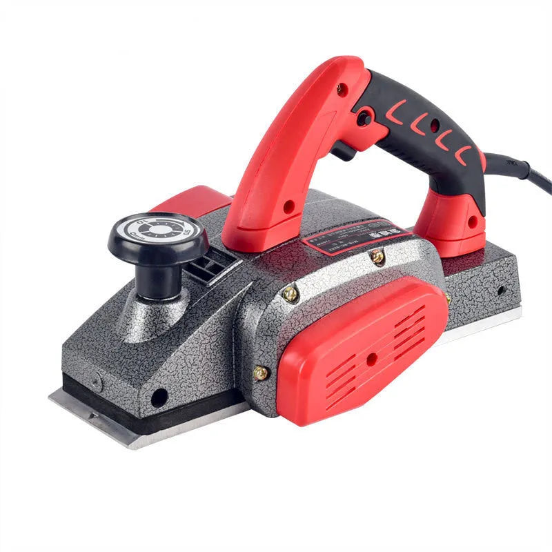 Red desktop electric wood planer with aluminium housing showing 82mm planing width