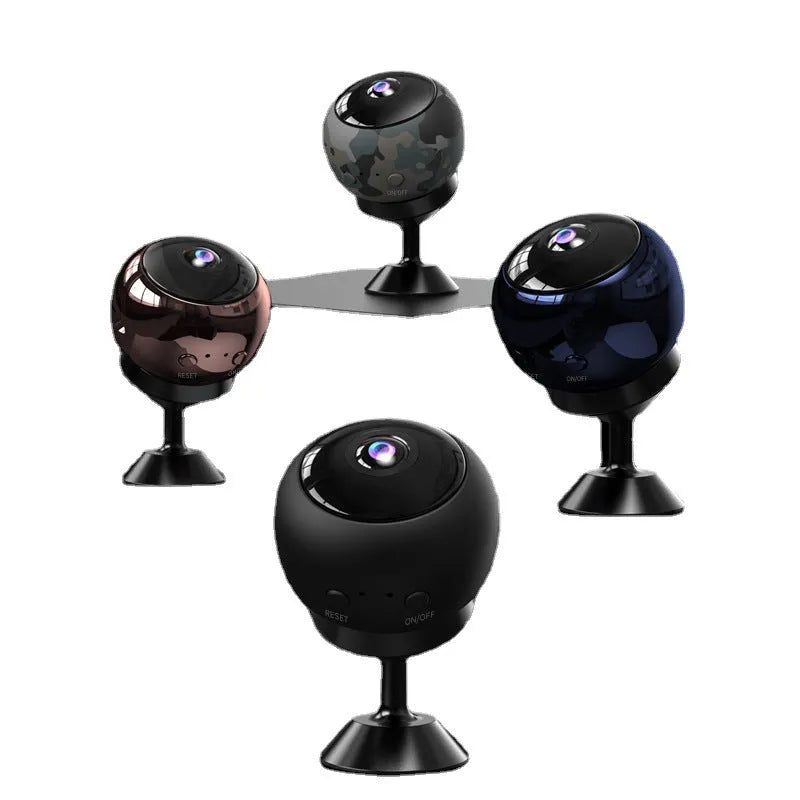 White or black 1080p wireless WIFI security camera with fixed lens on a desk.