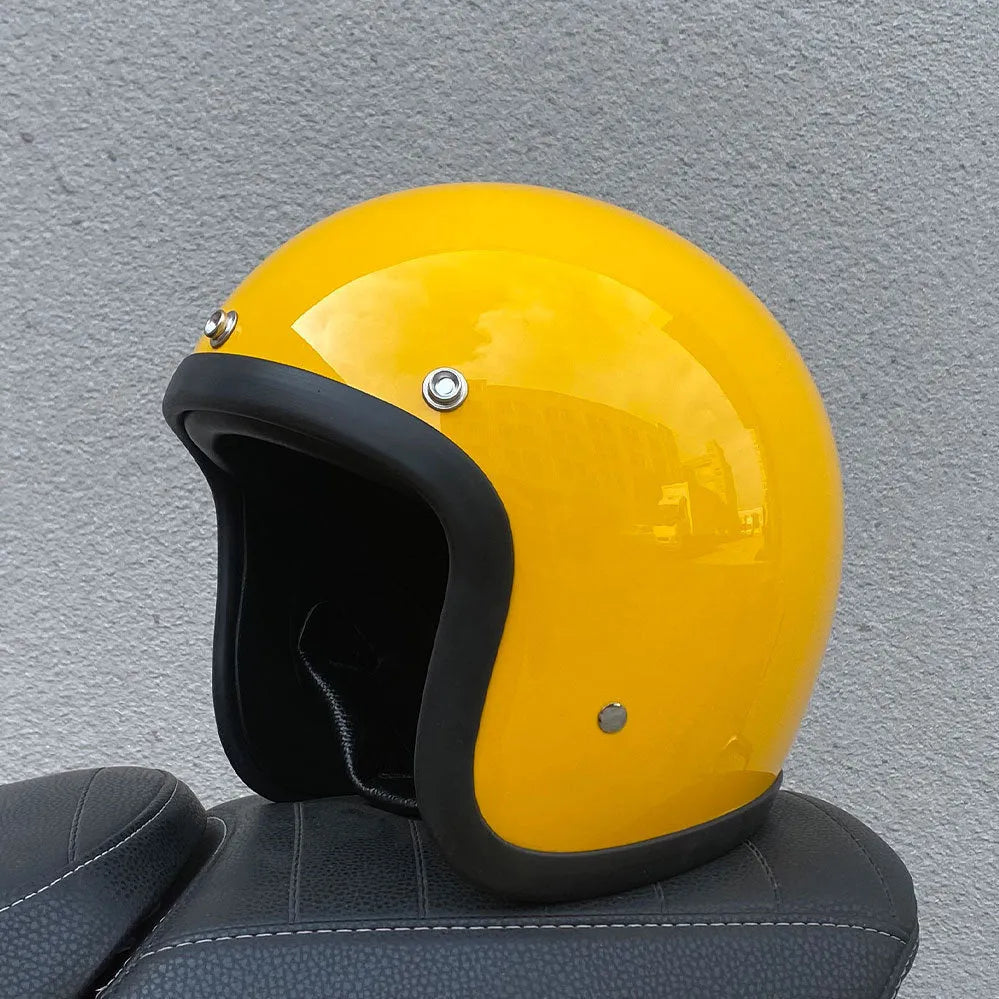 Retro-style half motorcycle helmet in fibreglass, shown in a cement grey colour option.