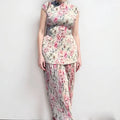 Long sleeve printed chiffon dress and top set on a hanger, showing high waist design.