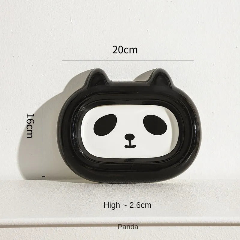 Ceramic pet bowl with an animal design, shown on a table.