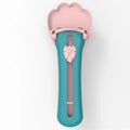 Green and pink pet food squeezer feeder with attached spoon for dispensing liquid and dry food