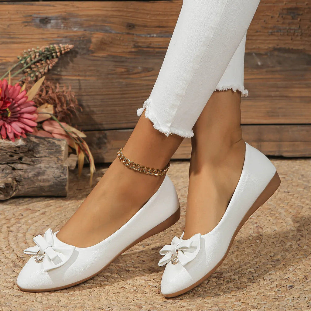 Women's beige casual flat shoes with a bowknot and round toe, showing the shallow mouth design.