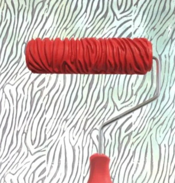 Red 7 inch textured paint embossing roller with patterned rubber sleeve and plastic handle