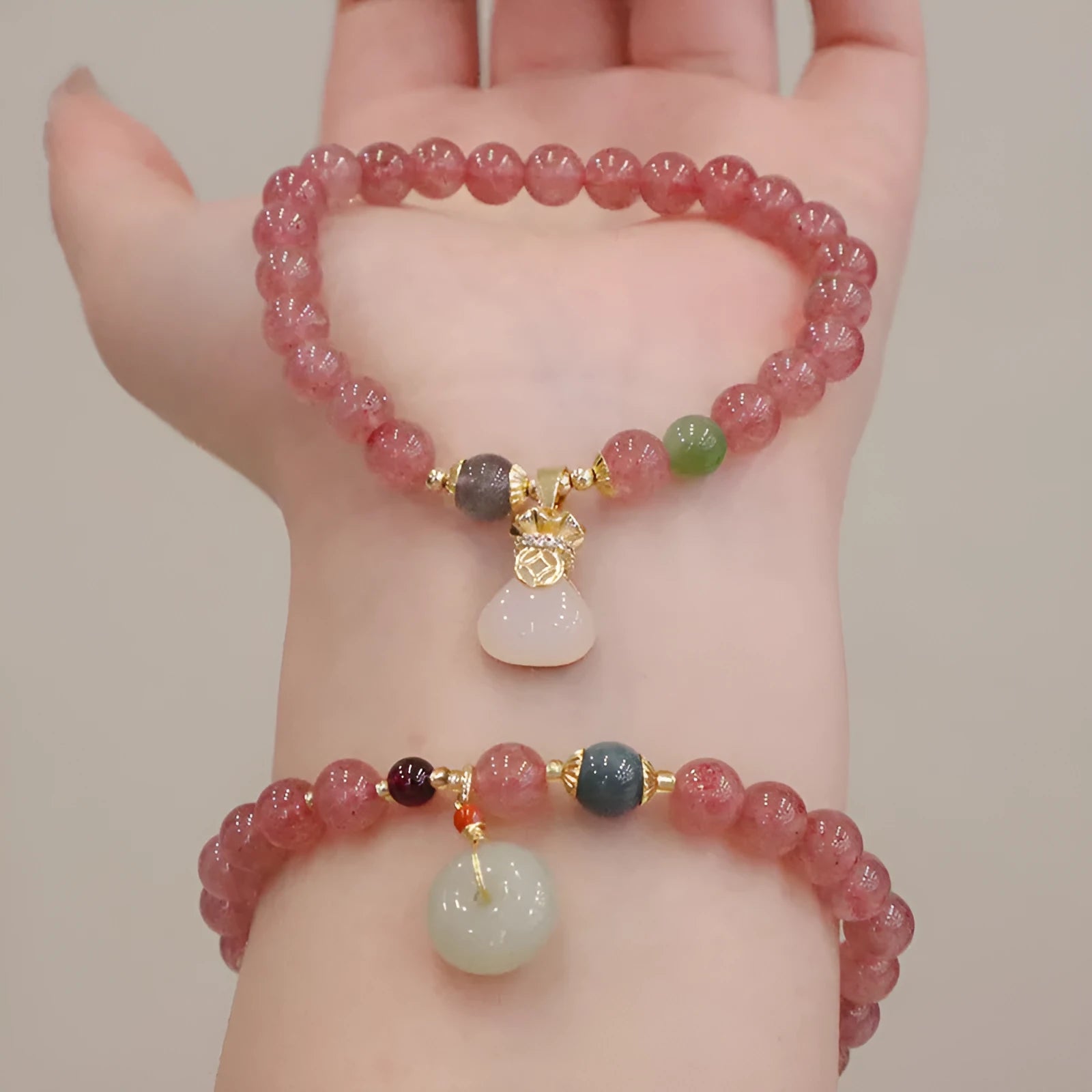 Pink strawberry quartz purse bracelet with geometric shapes and safety buckle closure