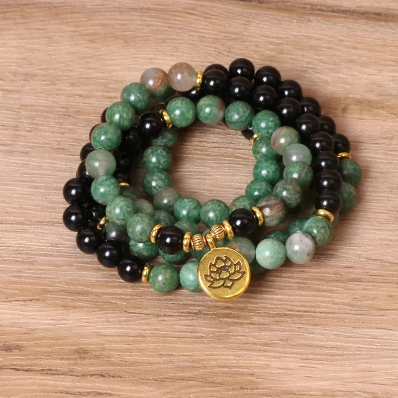 Green and black elastic beaded long bracelet made from alloy material.
