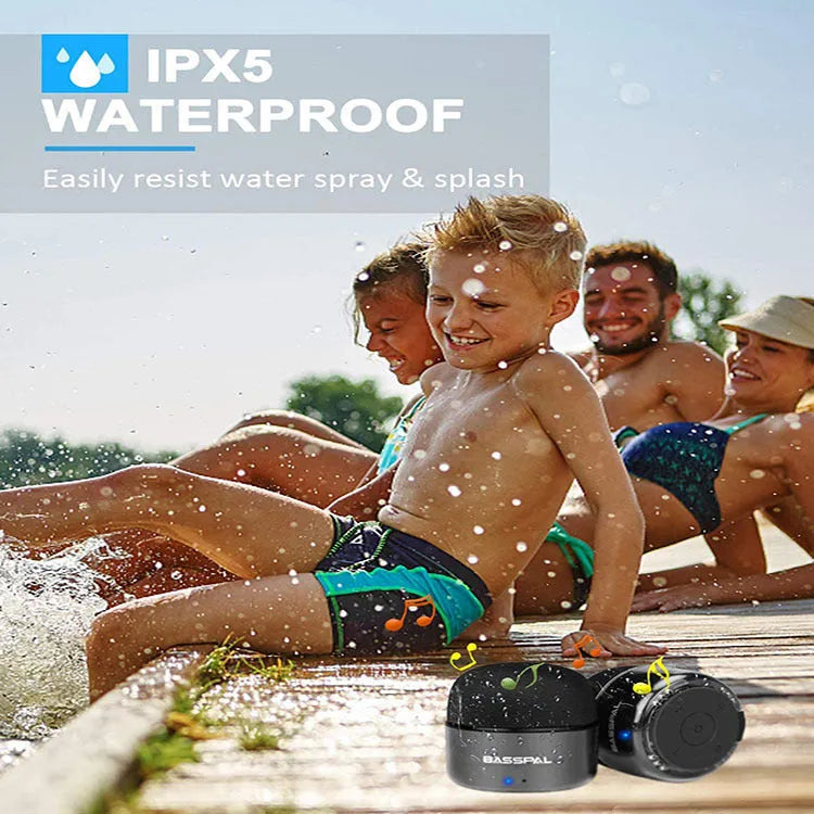Black portable waterproof Bluetooth speaker with button controls showing compact size