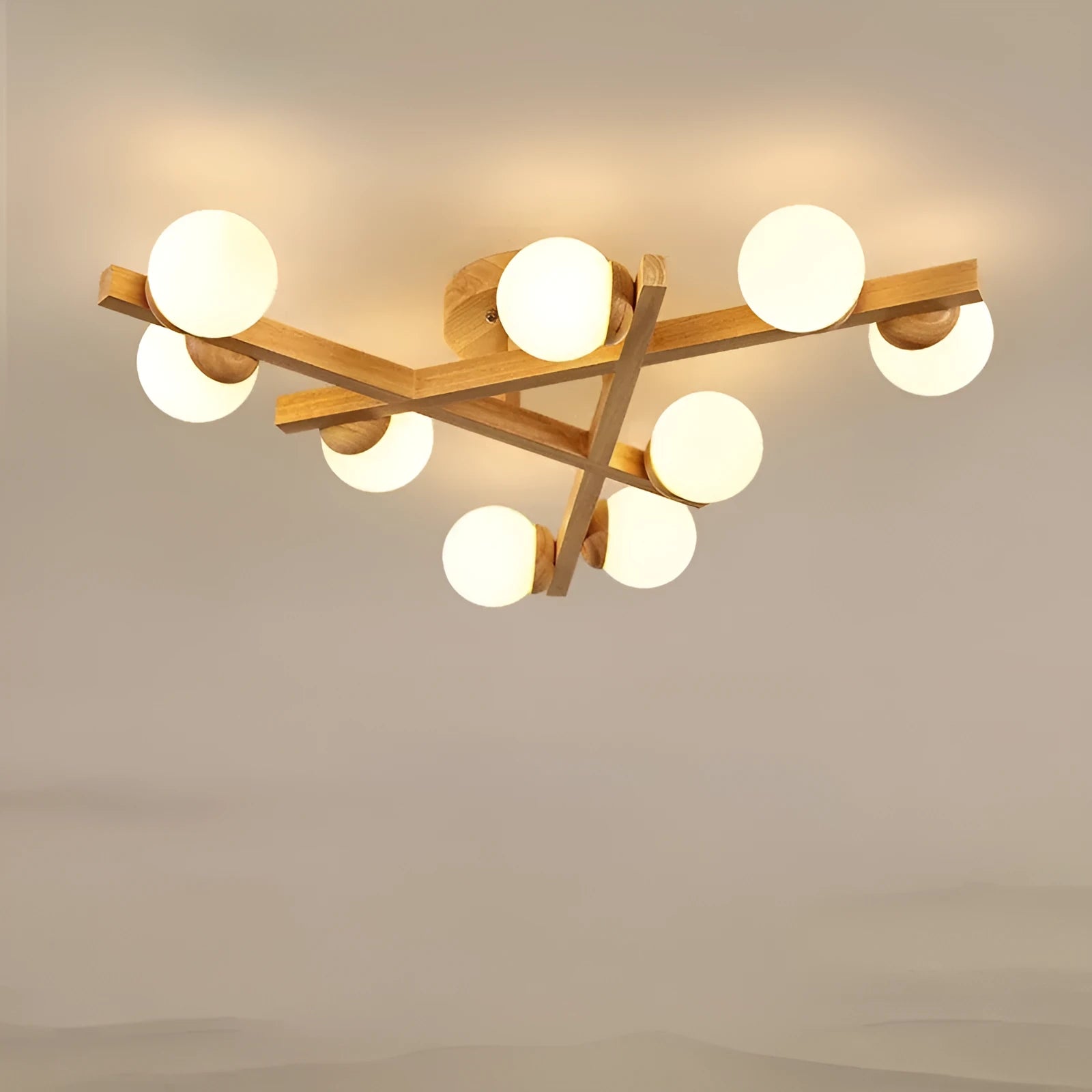 Modern wooden finish ceiling light with three adjustable lamp heads in a neutral white colour.