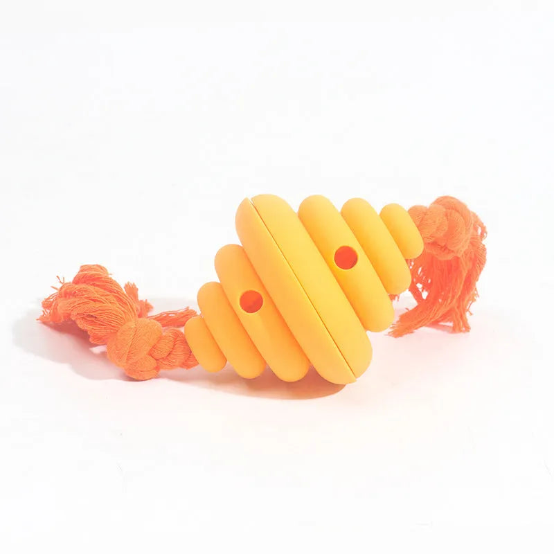 Green and yellow silicone dog ball with rope, showing split spiral design for treat dispensing