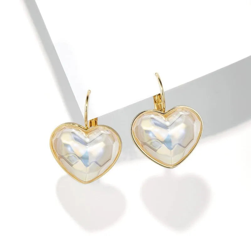 Gold women's ear clip with summer love design and clip-on fastening