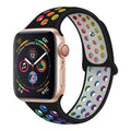 Silicone sports wristband with buckle in black, rainbow or white colour on a wrist.