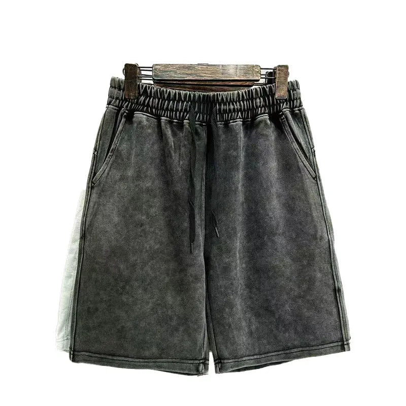 Men's distressed cotton casual shorts in loose straight fit showing fifth length measurement